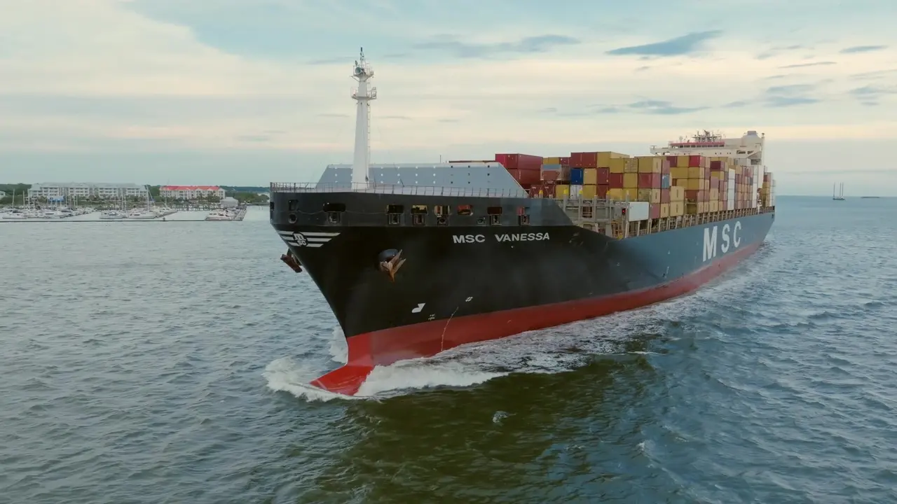 Cargo ship approaching across open water